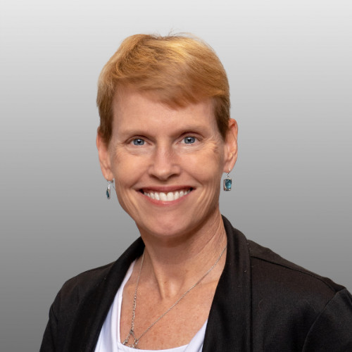Professional headshot of Tina Rust